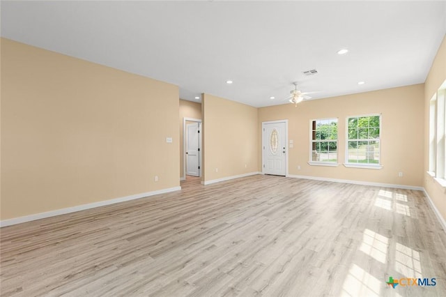 1700 Proctor Ave, Waco, TX 76708 - unfurnished living room featuring ceiling fan, light wood-style floors, baseboards, and recessed lighting
