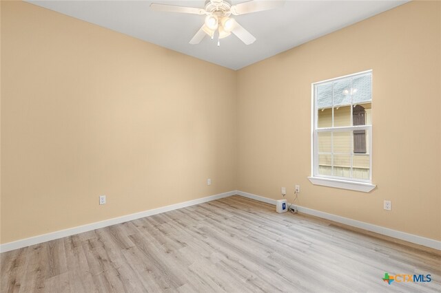 empty room featuring ceiling fan and light wood-type flooring