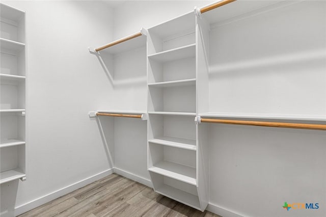 1700 Proctor Ave, Waco, TX 76708 - walk in closet with wood finished floors