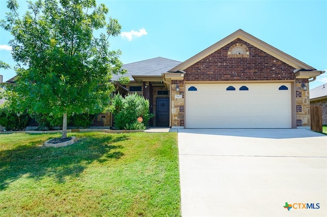 view of front facade featuring a garage and a front lawn