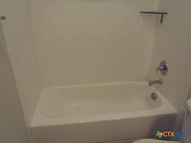 791 Hazy Hills Loop, Dripping Springs, TX 78620 - full bathroom featuring toilet and shower / washtub combination