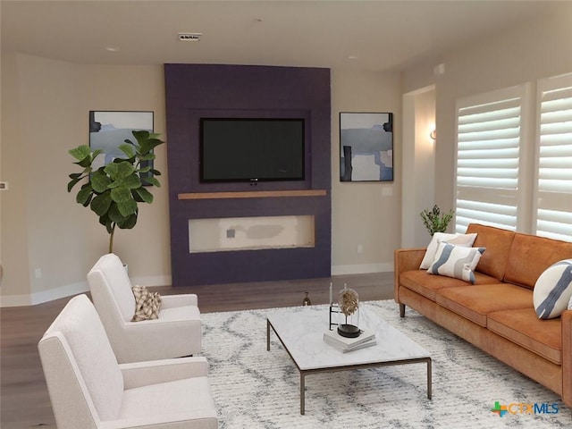 791 Hazy Hills Loop, Dripping Springs, TX 78620 - living area featuring wood finished floors and baseboards