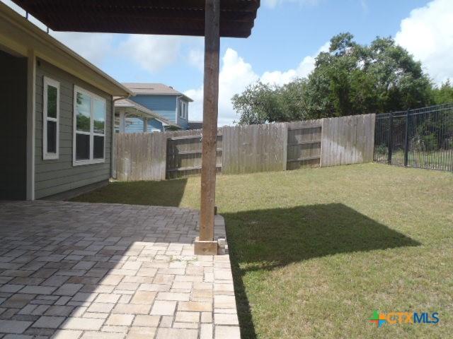 791 Hazy Hills Loop, Dripping Springs, TX 78620 - fenced backyard with a patio