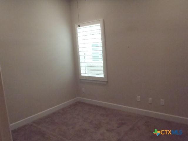 791 Hazy Hills Loop, Dripping Springs, TX 78620 - spare room featuring baseboards and carpet flooring