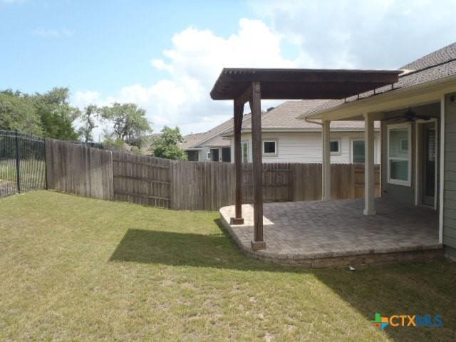 791 Hazy Hills Loop, Dripping Springs, TX 78620 - fenced backyard featuring a patio and ceiling fan