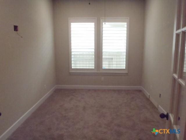 791 Hazy Hills Loop, Dripping Springs, TX 78620 - spare room with healthy amount of natural light and carpet