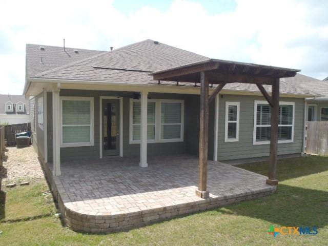 791 Hazy Hills Loop, Dripping Springs, TX 78620 - rear view of house with a shingled roof, a fenced backyard, and a patio