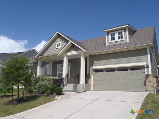 791 Hazy Hills Loop, Dripping Springs, TX 78620 - craftsman-style house featuring a garage, driveway, and a porch