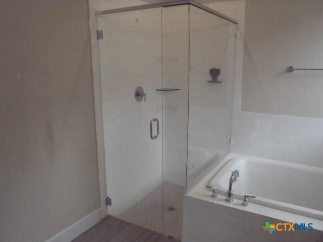 791 Hazy Hills Loop, Dripping Springs, TX 78620 - bathroom with a bath and a shower stall