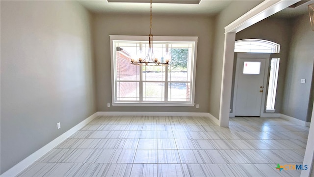 entryway featuring a chandelier