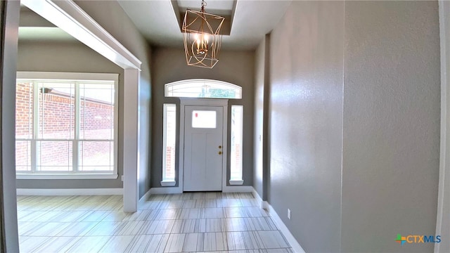 entryway featuring a chandelier