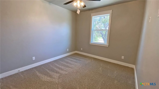 carpeted empty room featuring ceiling fan