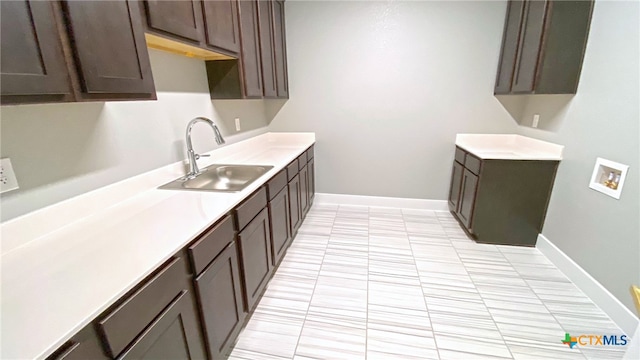 kitchen with dark brown cabinets and sink