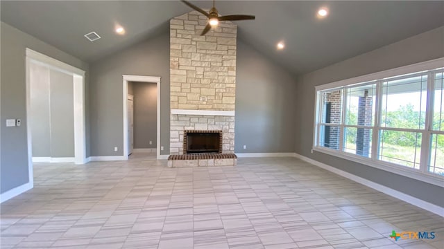 unfurnished living room with a fireplace, ceiling fan, and high vaulted ceiling