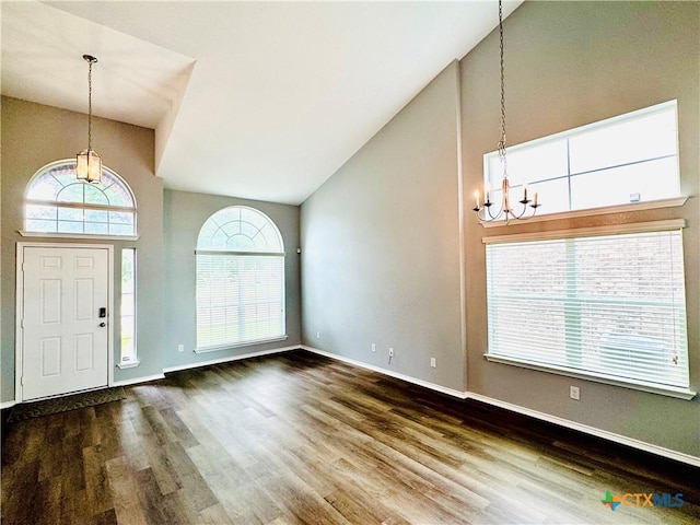 3413 Malmaison Rd, Killeen, TX 76542 - foyer entrance featuring a chandelier, high vaulted ceiling, wood finished floors, and baseboards