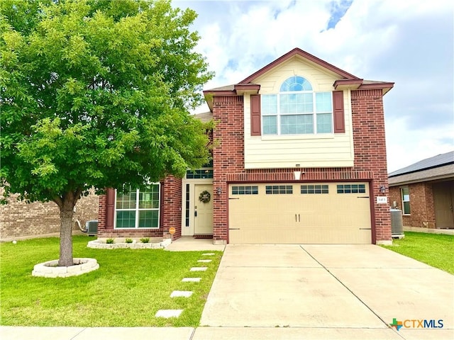 3413 Malmaison Rd, Killeen, TX 76542 - traditional-style home featuring a garage, driveway, a front lawn, brick siding, and cooling unit