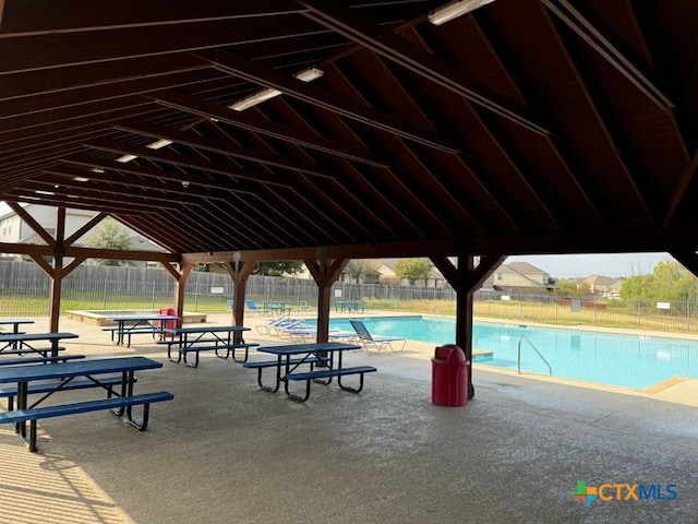 view of property's community with a patio and a pool