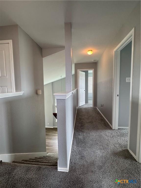 3413 Malmaison Rd, Killeen, TX 76542 - corridor featuring carpet, baseboards, and an upstairs landing