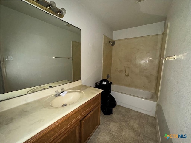 full bathroom with shower / tub combination, vanity, and toilet