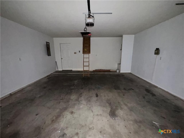 garage featuring electric panel and a garage door opener