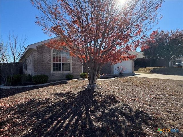 view of side of home with a garage