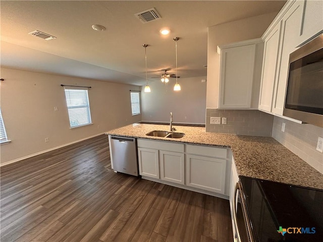 kitchen featuring sink, white cabinets, and stainless steel appliances