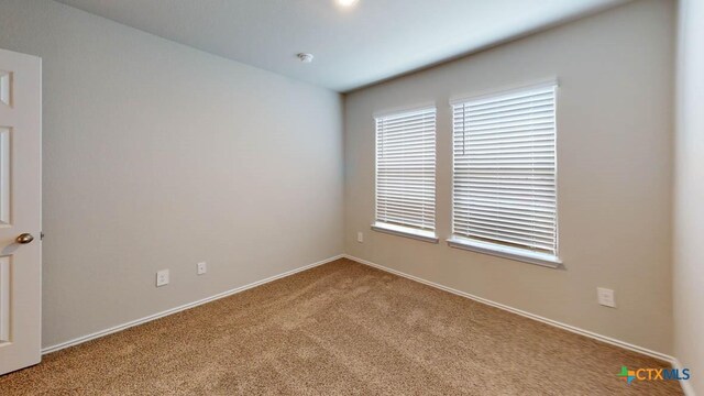 view of carpeted spare room