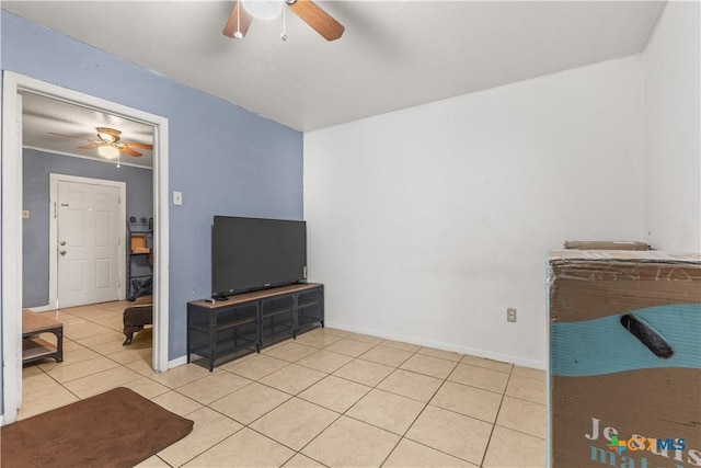 tiled living room with ceiling fan