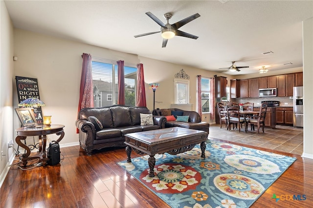 326 Comal Run, Hutto, TX 78634 - living room with a ceiling fan and wood-type flooring
