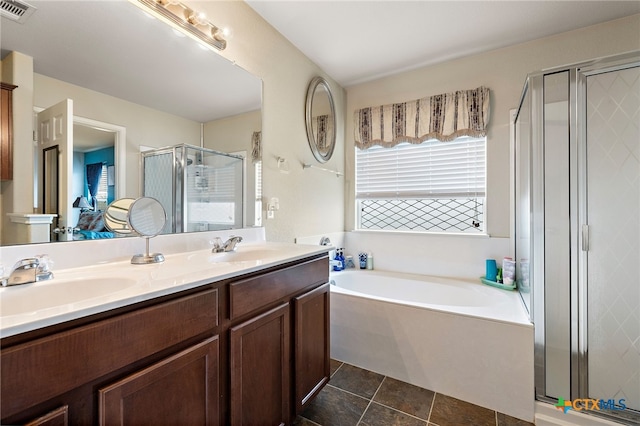 326 Comal Run, Hutto, TX 78634 - full bathroom with a stall shower, a garden tub, double vanity, and tile patterned floors