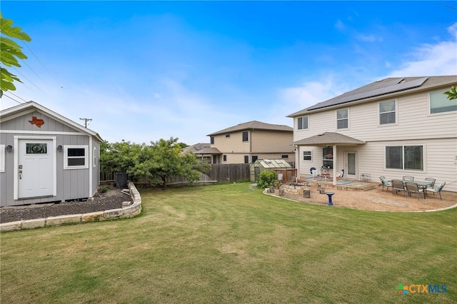 326 Comal Run, Hutto, TX 78634 - fenced backyard with a storage shed and a patio