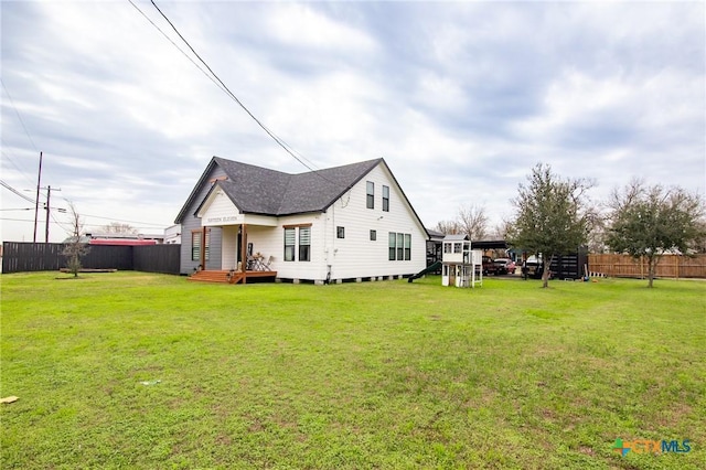 view of home's exterior featuring a yard and a playground