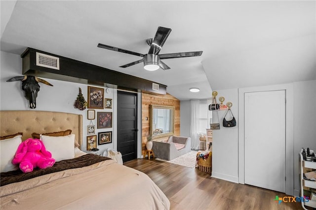 bedroom featuring dark hardwood / wood-style flooring and ceiling fan