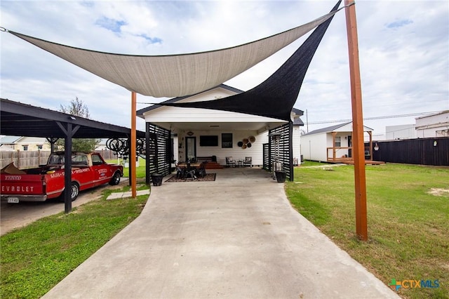 view of front of house with a front yard and a carport