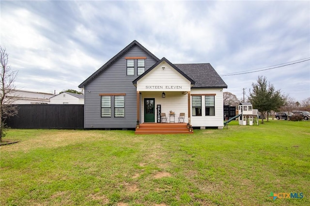 back of house featuring a yard