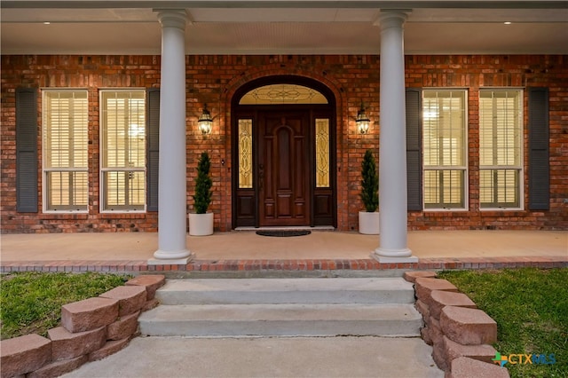 doorway to property featuring covered porch