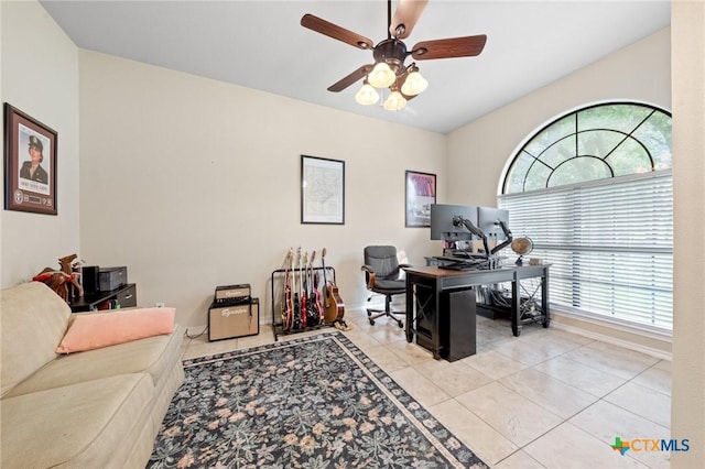 tiled home office featuring baseboards and a ceiling fan