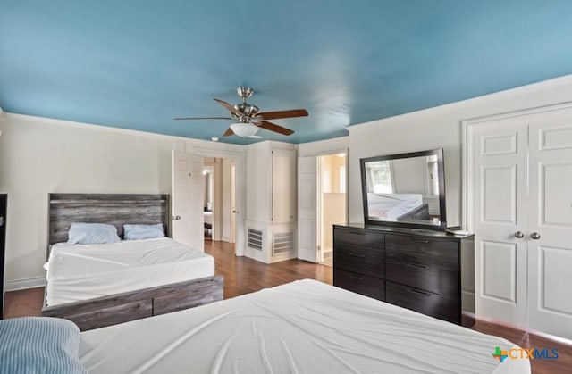 bedroom featuring dark hardwood / wood-style flooring and ceiling fan