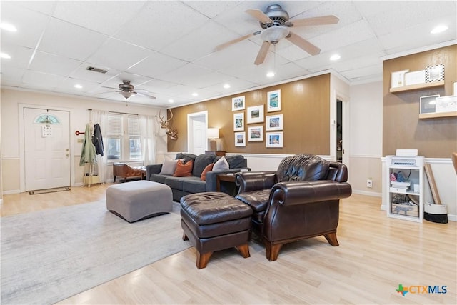 859 Pine St, New Braunfels, TX 78130 - living area featuring ceiling fan, a drop ceiling, and light wood-style flooring