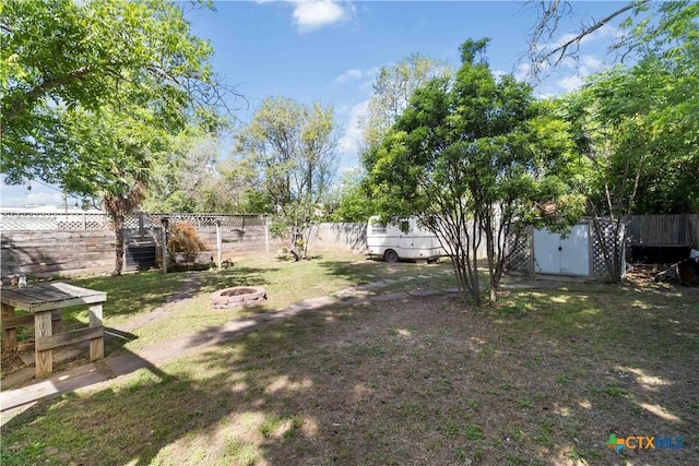 859 Pine St, New Braunfels, TX 78130 - fenced backyard with an outdoor fire pit