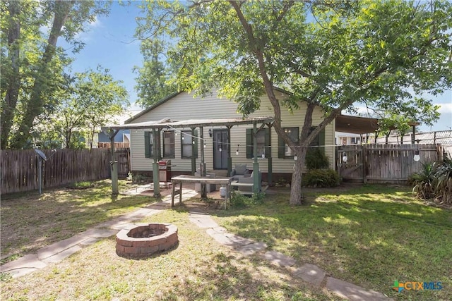 859 Pine St, New Braunfels, TX 78130 - back of property with an outdoor fire pit and a patio