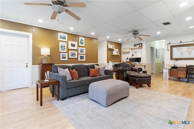 859 Pine St, New Braunfels, TX 78130 - living room with a ceiling fan, light wood-type flooring, wainscoting, a drop ceiling, and recessed lighting