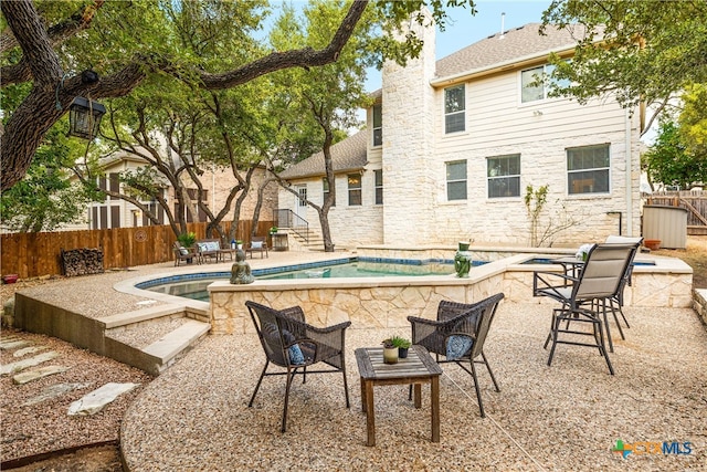 view of swimming pool featuring a patio