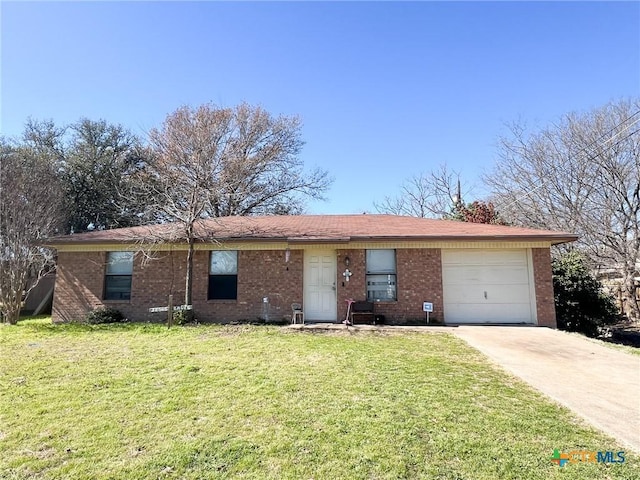 single story home featuring a garage and a front lawn