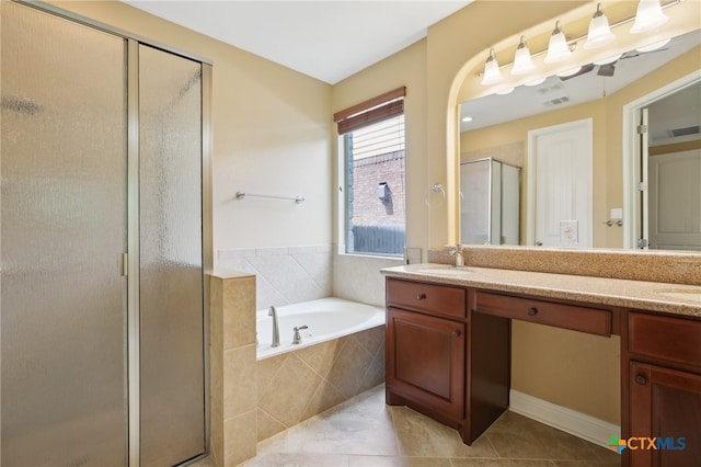 12109 Bryony Dr, Austin, TX 78739 - bathroom featuring double vanity, a stall shower, a bath, and tile patterned flooring