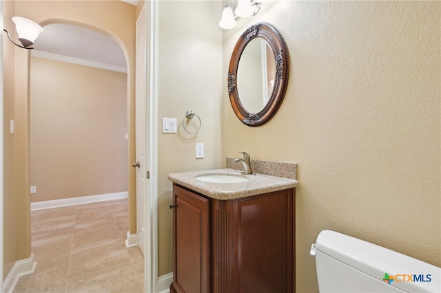 12109 Bryony Dr, Austin, TX 78739 - bathroom featuring vanity, ornamental molding, toilet, and tile patterned floors