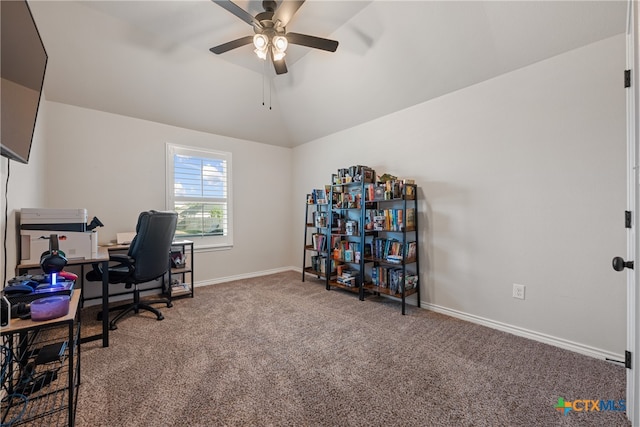 carpeted office space featuring ceiling fan and vaulted ceiling