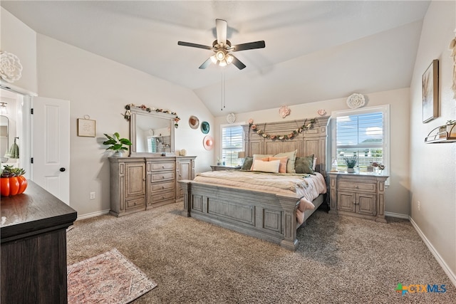 carpeted bedroom featuring lofted ceiling and ceiling fan