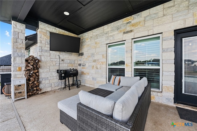 view of patio with outdoor lounge area and area for grilling