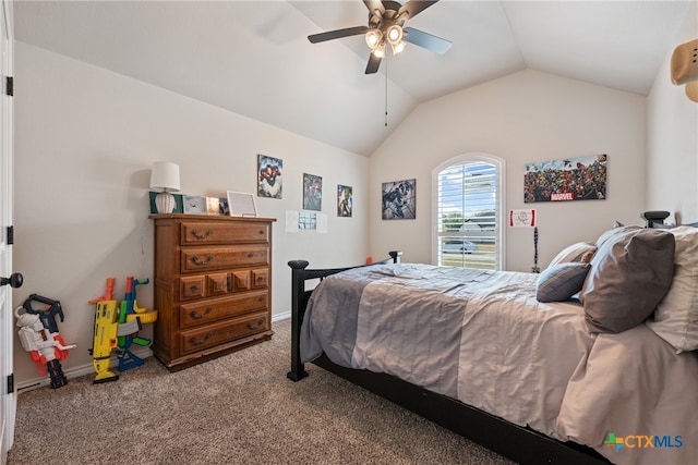 carpeted bedroom with ceiling fan and vaulted ceiling